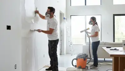 Drywall repair and wall painting in Royal Oak, MI home by professional painting contractors